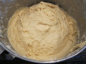 With 9 cups of flour, just barely dry enough to not glop all over your hand when touched lightly.