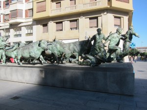 A statue depicting the running of the bulls, in Pamplona.