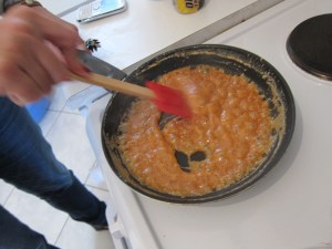 This is a good caramel color. You don't want it to get too much darker, or you've probably burnt it. If you think you may have burnt it, let it cool a bit and taste it before using it, because no amount of added powdered sugar will hide the grody flavor of burnt sugar.