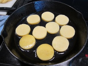 They turn a more bold yellow, like those two at the bottom right, before starting to brown. (I flipped those back to cook further.)