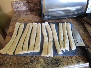 My supermarket didn't have tubes of breadsticks, but did have tubes of pizza dough, so I just cut one of those into 12.